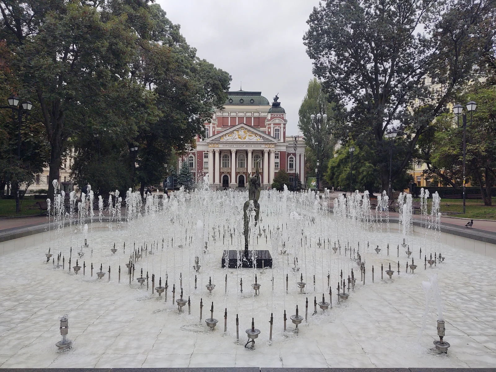 The iconic brass ballerina fountain flowing in front of Ivan Vazov National Theater in Sofia
